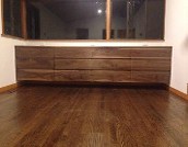 a wooden dresser or a low sideboard