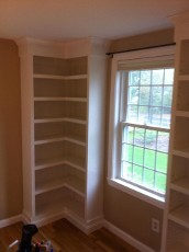 A built-in floor-to-ceiling corner cabinet is a storage solution designed to maximize space in a room, particularly in corners where traditional furniture might not fit well