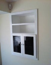 image shows a structure with shelves and doors, which is a common feature of built-in cabinets