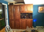 a set of kitchen cabinets, possibly with a built-in aquarium