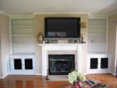 image shows a custom-built wall unit with a fireplace and TV