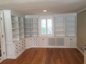 image displays a built-in bookcase with shelves